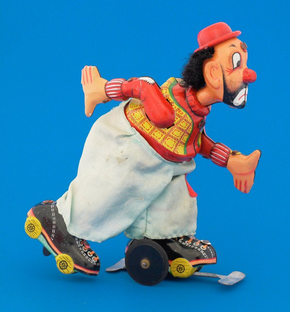 A tin plate roller-skating clown