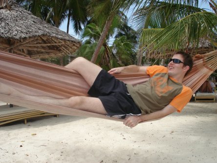 Mike on a hammock at the beach in Diani Reef, Kenya