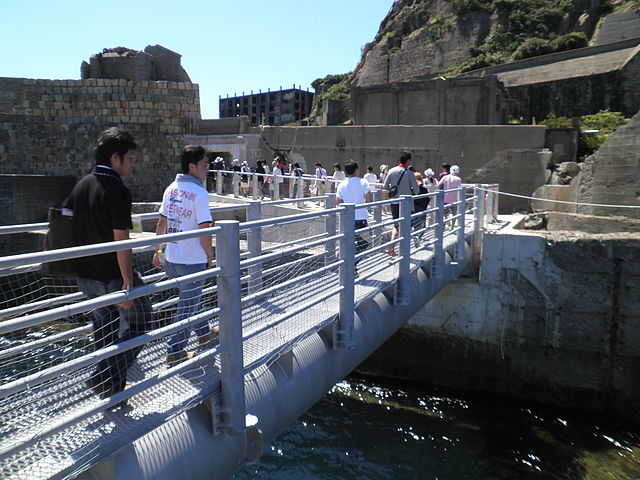 Tourists arriving at Gunkanjima