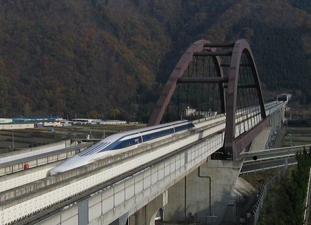 Japan’s magnetic levitation train crosses a bridge after emerging from a tunnel