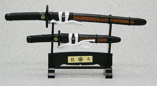 Two mini samurai swords that can be used as letter openers