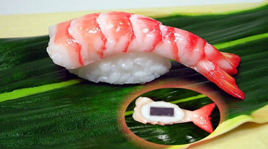 A fridge magnet in the shape of shrimp nigirizushi