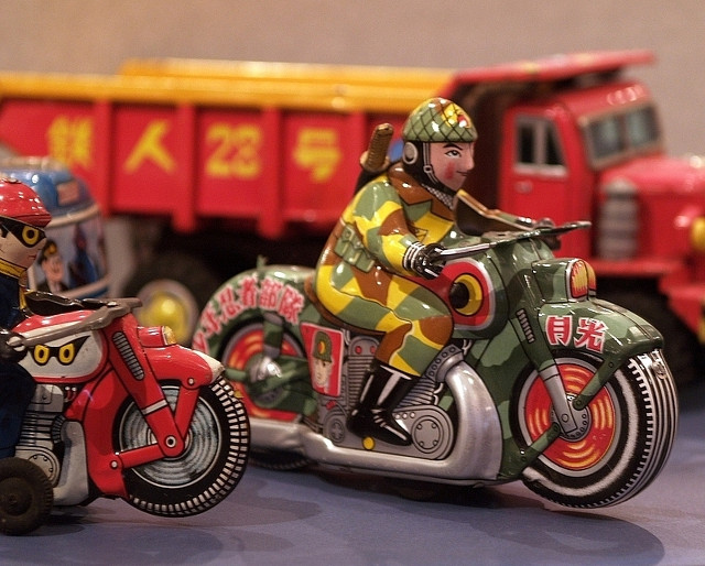 Tin toy motorbikes and a truck