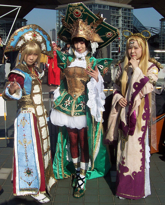 Three women cosplay in highly elaborate costumes at Comiket (コミケット)