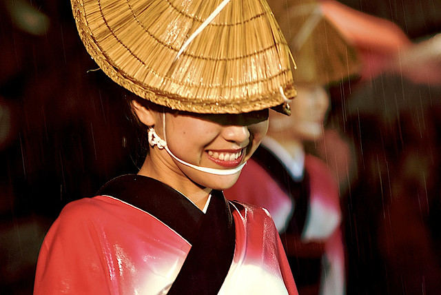 An Awaodori dancer in pouring rain