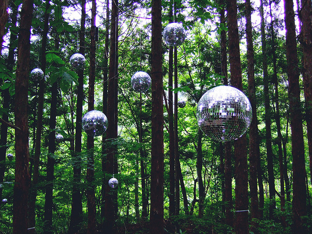 Disco balls suspended amongst trees at the Fuji Rock Festival