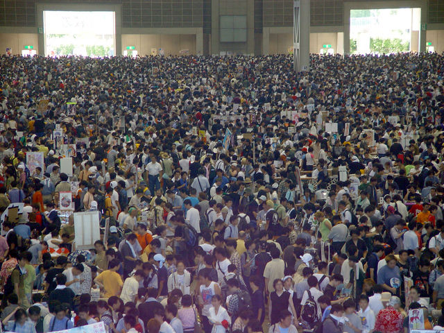 Masses of people and doujinshi stalls in one of the giant halls of Tokyo Big Sight during Comic Market