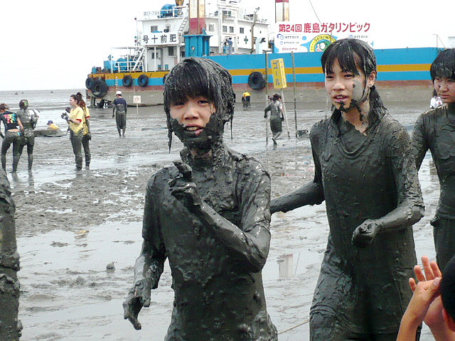 Girls covered in mud at the Kashima Gatalympics