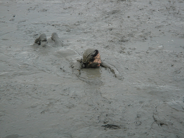 A woman swimming in mud at the Kashima Gatalympics