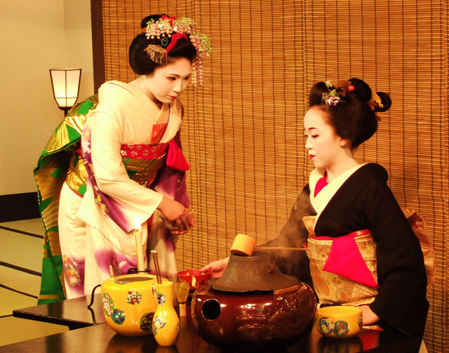 A maiko and a geisha making tea before the Miyako Odori dances
