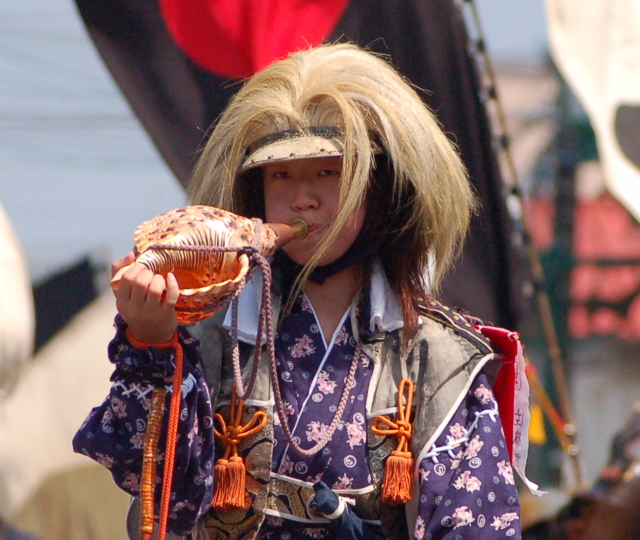 A rider blowing at conch horn at Soma Nomaoi
