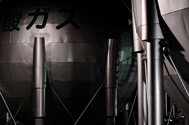 A close-up view of silver spherical gas tanks in Yokkaichi