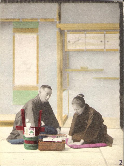 A Japanese fiancé and fiancée exchanging engagement presents