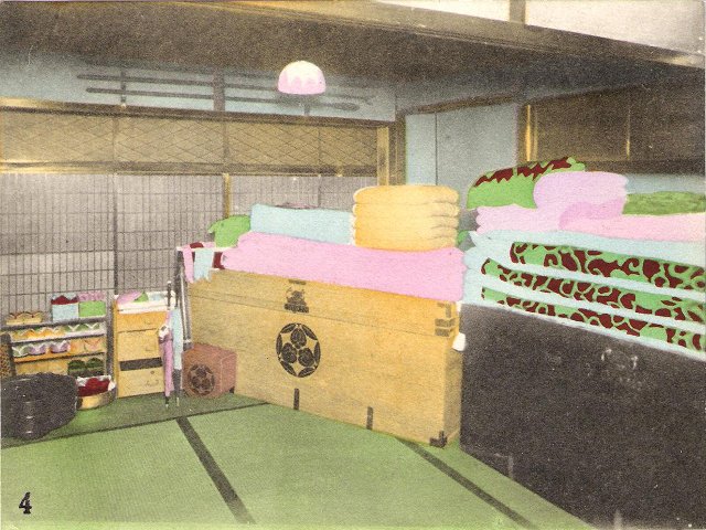 Chests and futons in a tatami-mat room in Japan