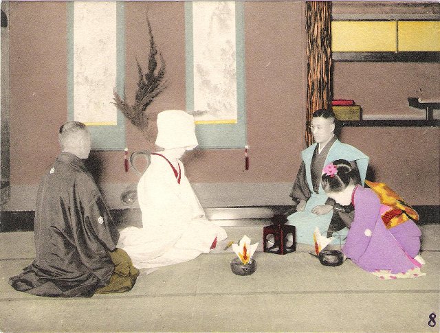 A Japanese wedding ceremony in which sake (rice wine) is exchanged between the bride and the bridegroom, who are both dressed in kimono