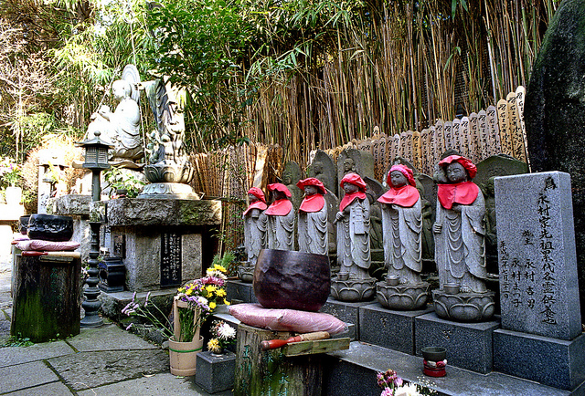 Statues and bamboo in the garden at Tamagawa Daishi Temple in Setagaya