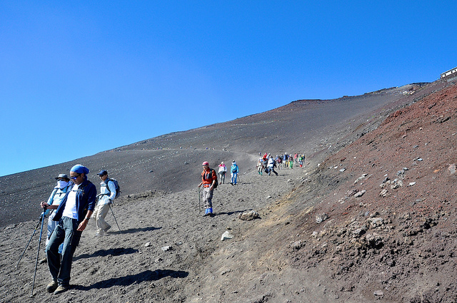 Climbers descending Mount Fuji’s barren landscape